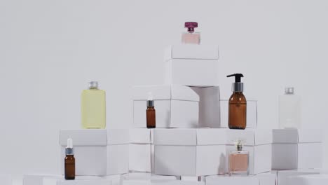 video of beauty products with white cardboard boxes with copy space over white background