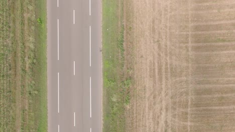 overhead view of traffic and cultivated fields in summer