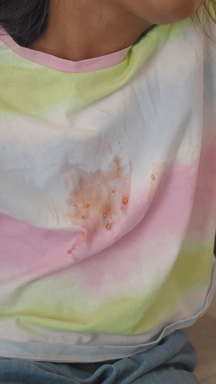 Close-up of Dirty Tie-Dye Shirt with Food Stain and Seeds