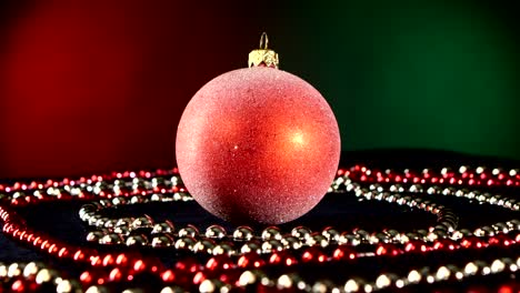 festive red christmas ornament with beaded garlands
