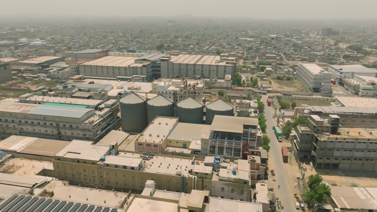 Aerial View of a Large Industrial Complex in a Densely Populated City