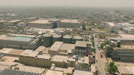 aerial view of a large industrial complex in a densely populated city