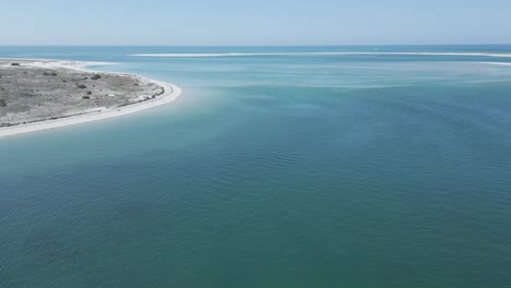 slow orbit flight from the beach over the beautiful sand formations at the top of the troia peninsula in portugal