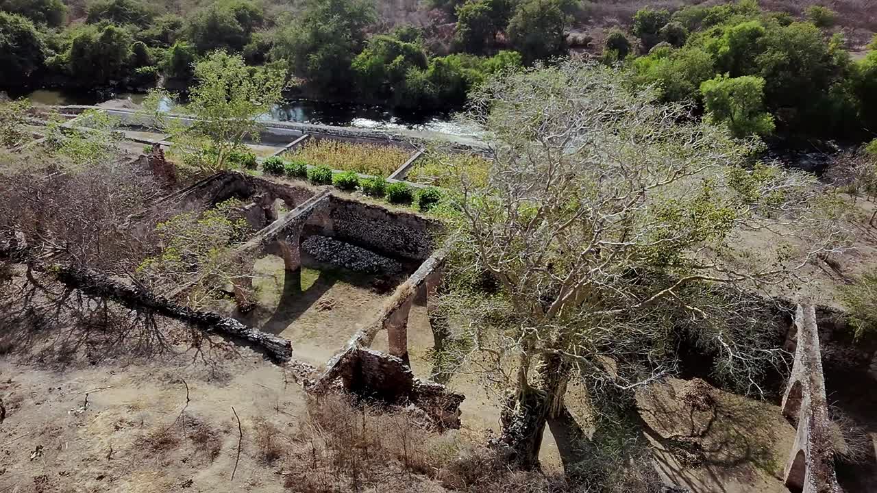 ascending shot over the majestic ruins of the hacienda and all its beautiful landscape
