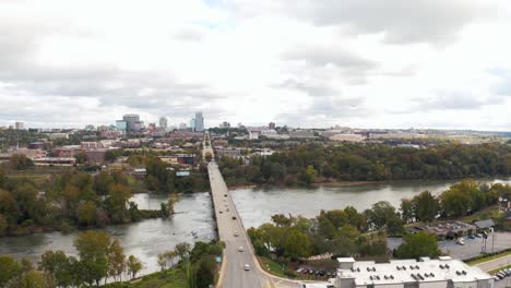 An-aerial-of-Columbia,-South-Carolina-from-the-River-District-revealing-the-Congaree-River-and-Skyline-in-the-fall