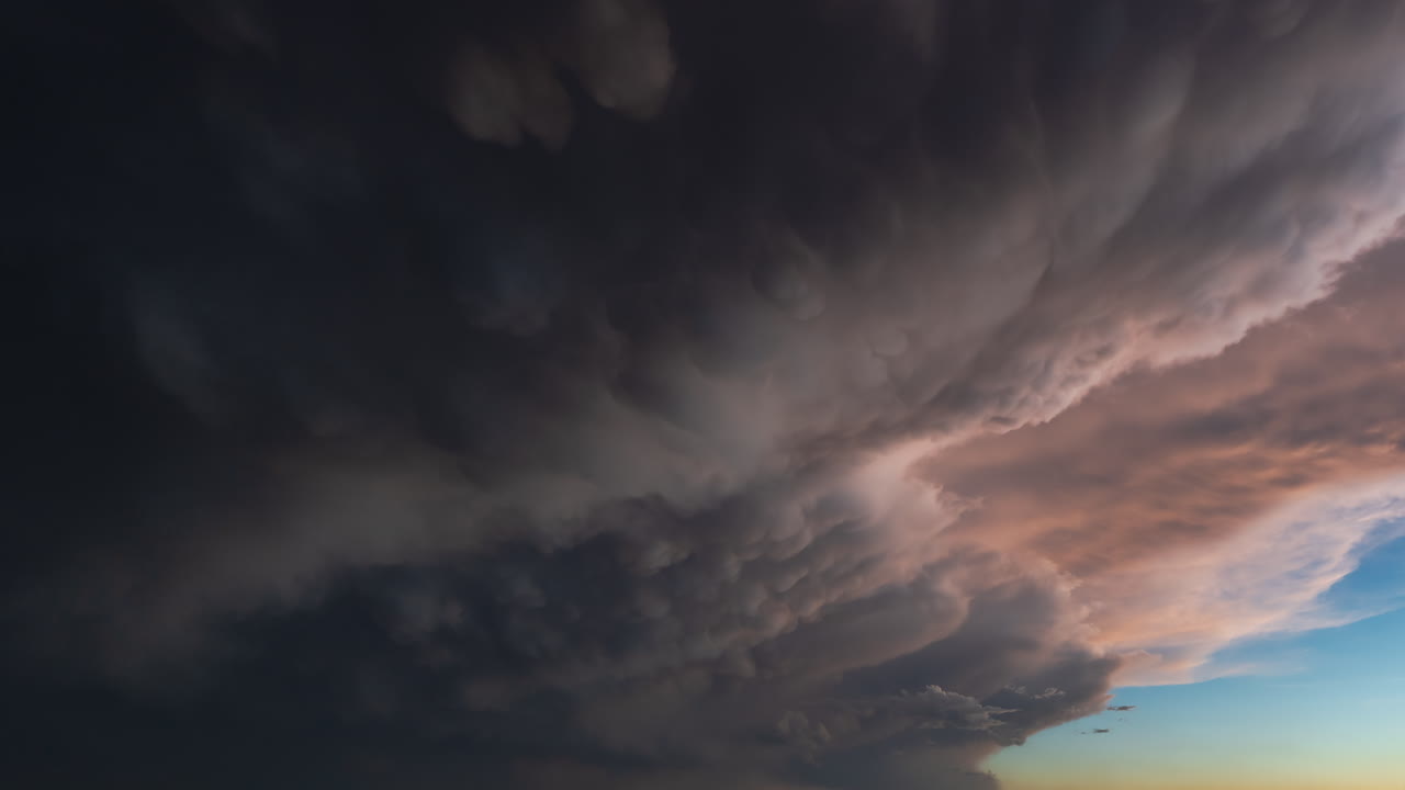 Dramatic cloudy sky with thunderclouds and deep shadows adding atmospheric weather texture