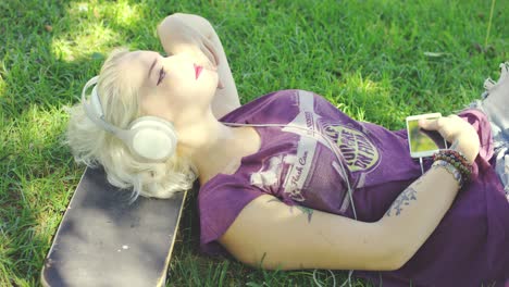 Young woman relaxing in the shade of tree