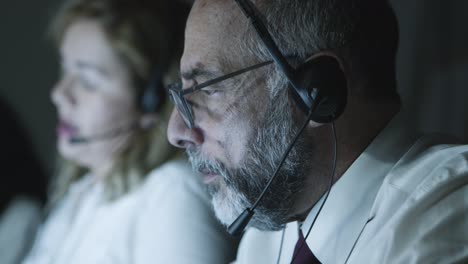 close-up view of mature teleworker in headset