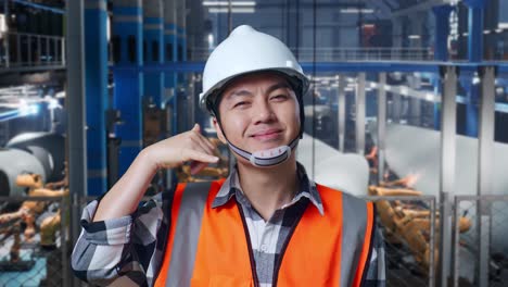 factory worker gesturing call