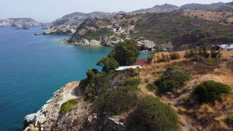 the camera rises above the jagged coastline of crete