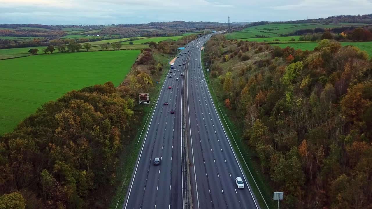 Drone shot above M1 Motorway in the UK around Junction 29 looking south and road curing to the right