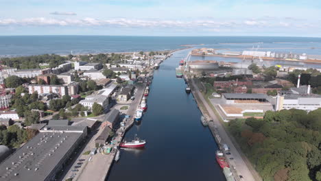 aerial view of fishing ships at river canal by baltic sea in liepaja, latvia