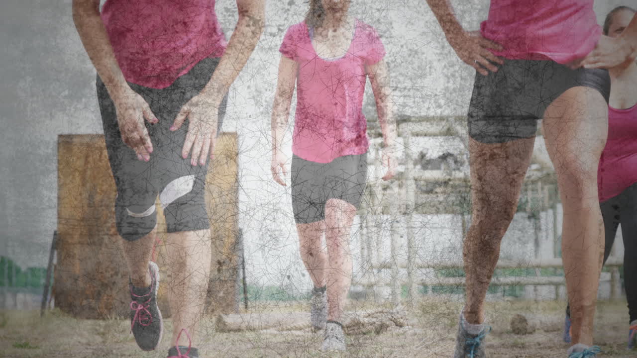 Women in pink shirts exercising over cracked earth texture animation