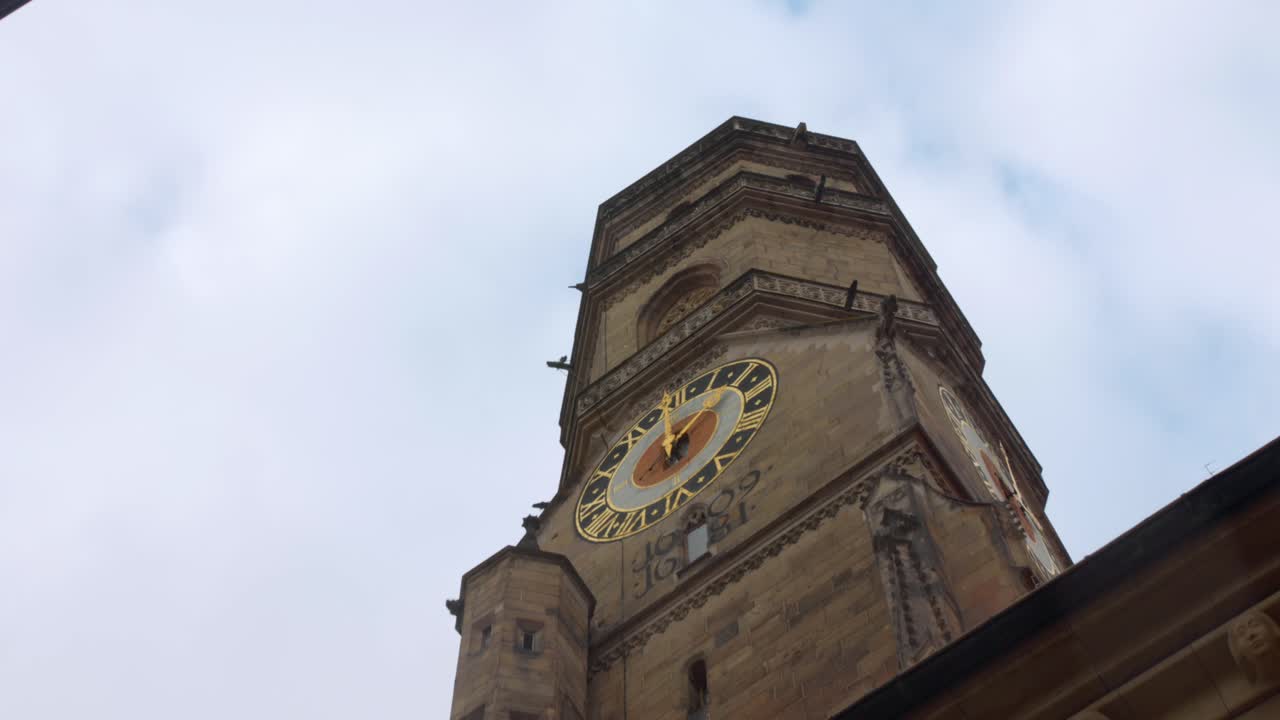 Low angle of the Stiftskirche church tower on Schillerplatz Stuttgart Germany.