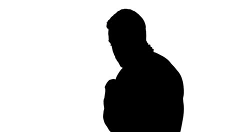 muscular silhouette of man wearing bandage and holding chain