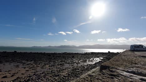 bright sunny wales uk mountain pebble coastline skyline timelapse idyllic relaxing calm scene