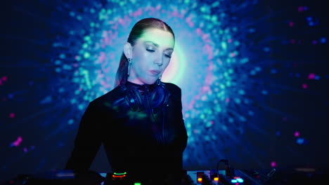 female dj performing at a nightclub