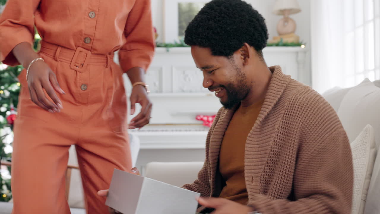 Christmas, black couple and gift to celebrate