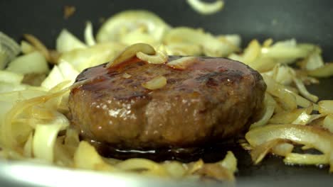 burger with onions in a baking pan preparation for dinner