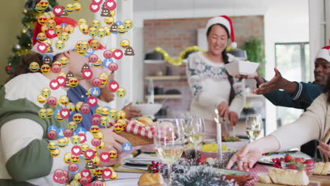 Group slicing salad and passing bread basket in kitchen, featuring social media marketing emojis