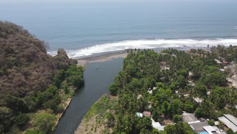 panoramic view of a paradisiacal beach near the junction between a river and the sea