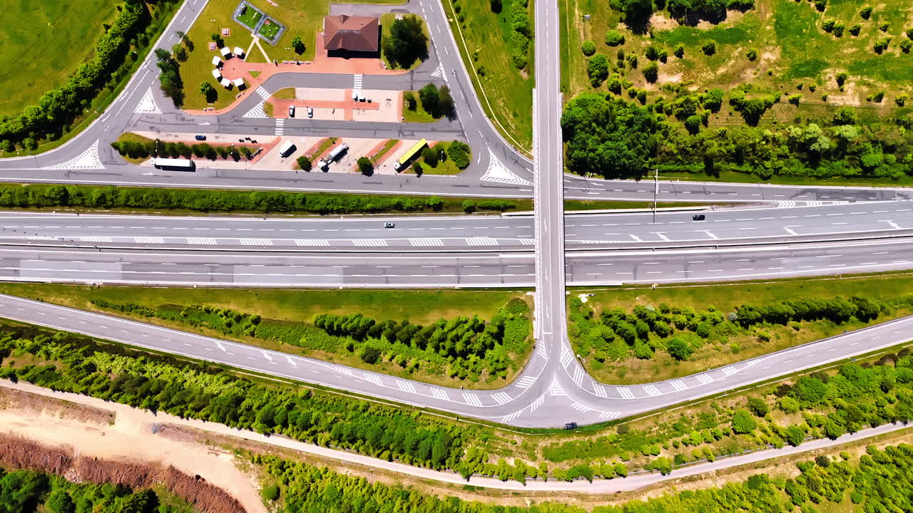 Few cars ride by the roads in the countryside. Highways and freeways in Slovakia. Top view