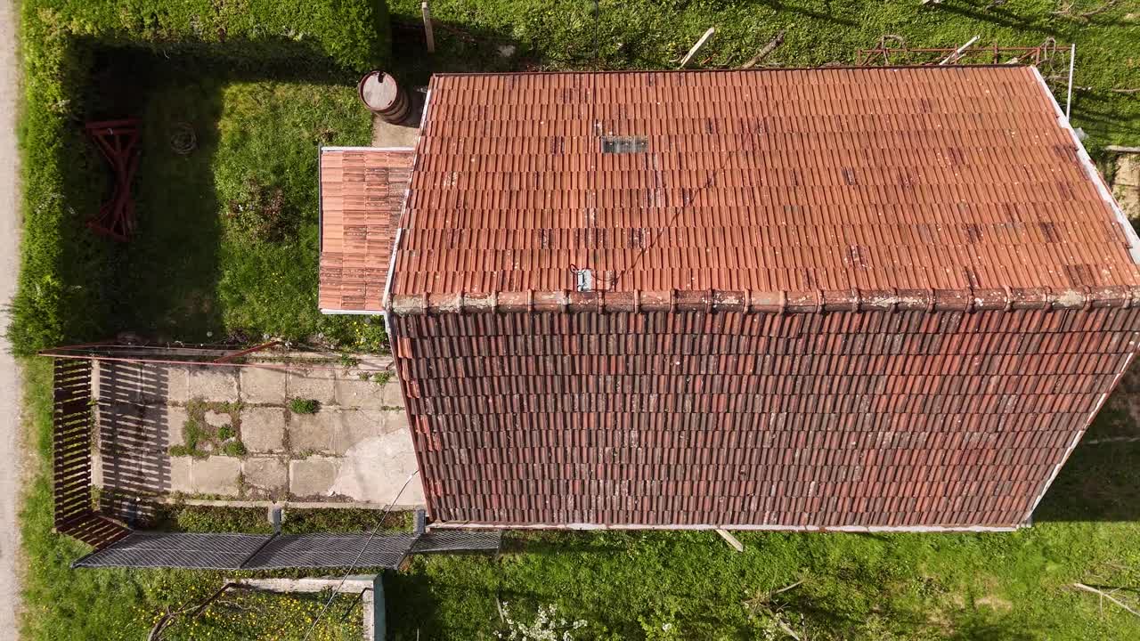 Aerial view of a forested landscape and a small village in spring
