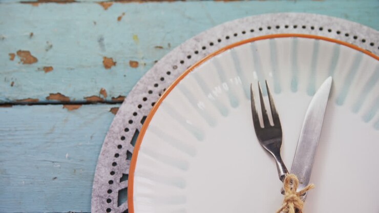 Various cutlery on wooden table 4k