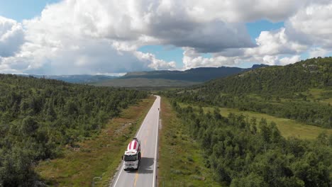 aerial view of concrete mixer truck driving through the road in setesdal, agder, norway