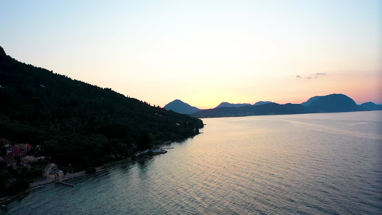 Tracking shot along the coast with sunset.