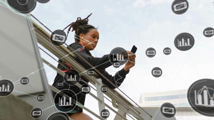 Animation of network of connections with icons over woman using smartphone