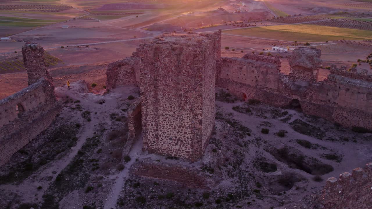 Sunrise over abandoned castle in Almonacid de Toledo