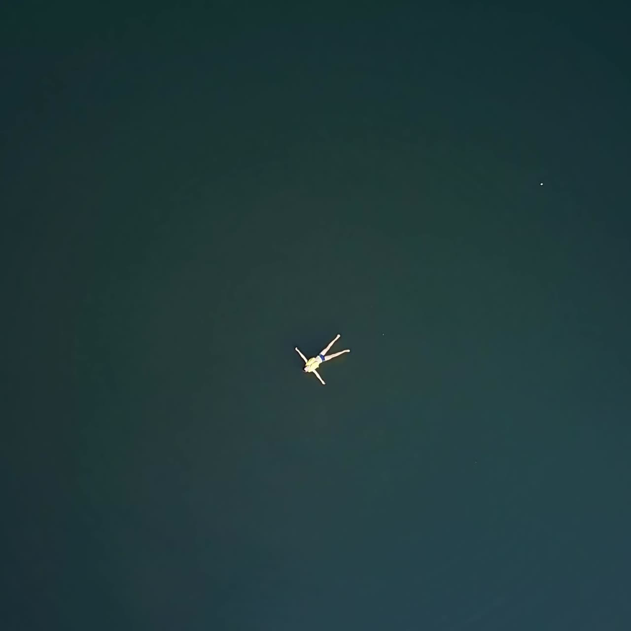 Boy swimming in river