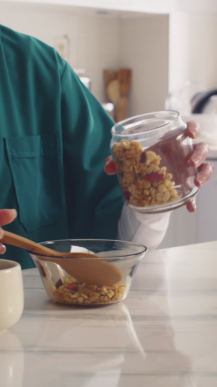 Unrecognizable Healthcare Worker Eating Muesli during Breakfast
