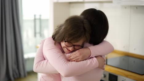 Happy-girls-with-down-syndrome-come-together-to-hug