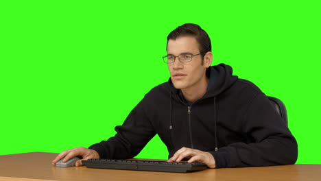 businessman typing at his desk