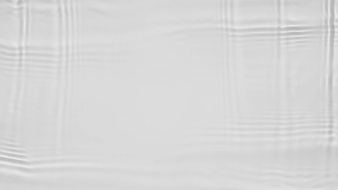 Waves of water on a gray background. | Premium Stock Video Footage