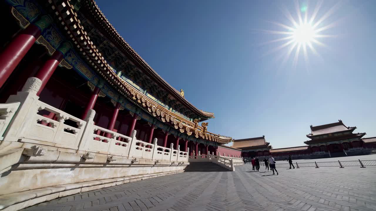 Wide-angle video shot of a historic temple under a bright sun, capturing intricate architecture