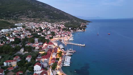 bol brač island drone aerial view port town harbour city croatia balkans balkan country adriatic sea south east europe evening