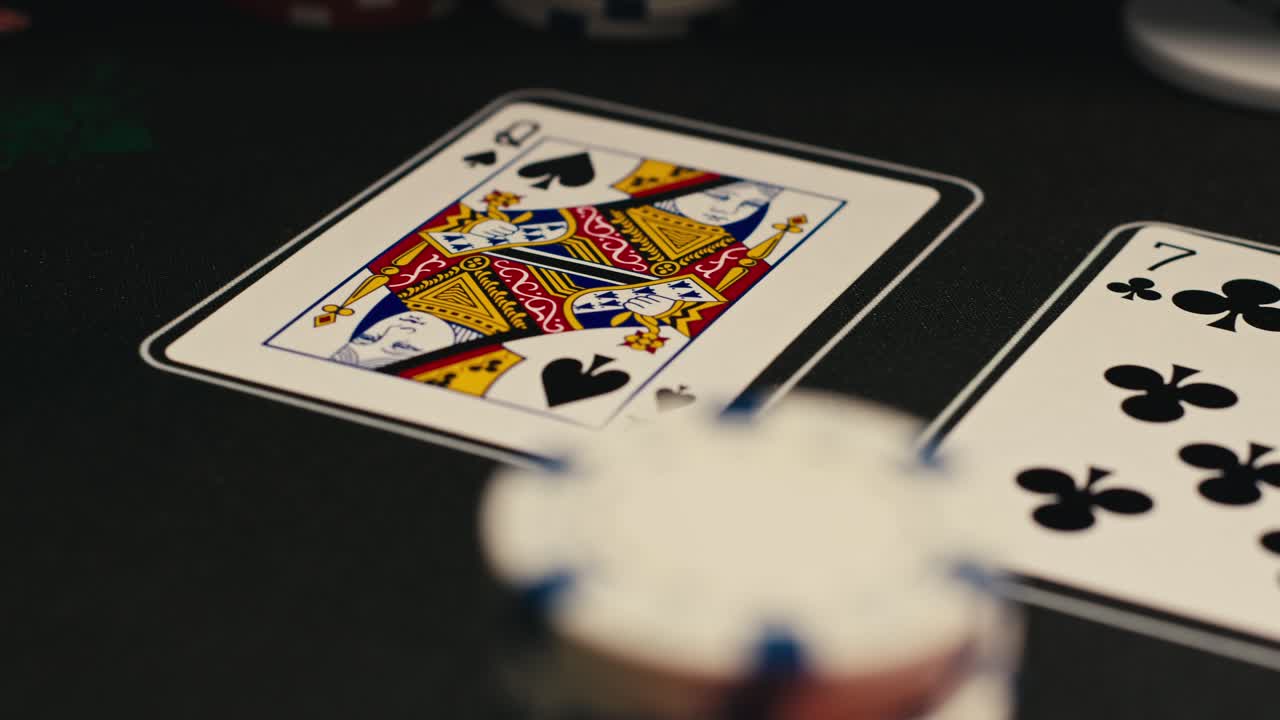 Hands managing poker chips on green table, reflecting intense poker gameplay with the element of chance and skill