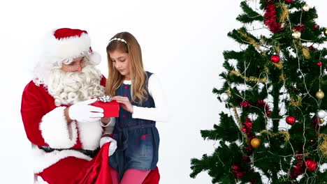 Little-girl-telling-santa-what-she-wants-for-christmas