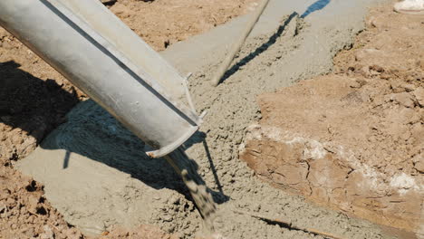 Concrete-Flows-Through-The-Pipe-Into-The-Foundation-Of-The-Basement-Construction-Of-Cottages-Concept