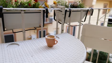 a coffee cup on a balcony table