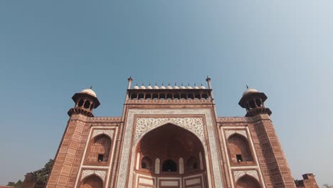 people walking to the main gateway (darwaza) to the taj mahal, india