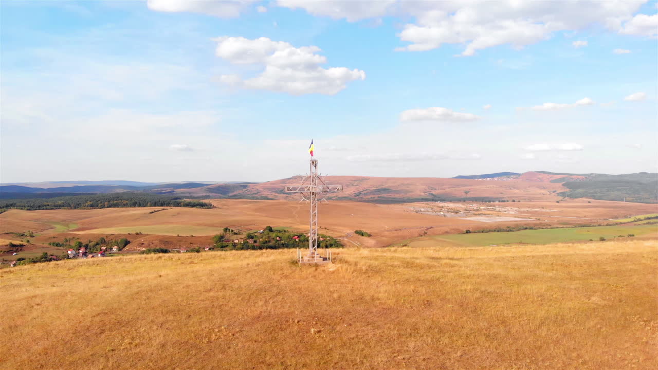 Large Cross with Romania flag on High Hill and landscape at Summer