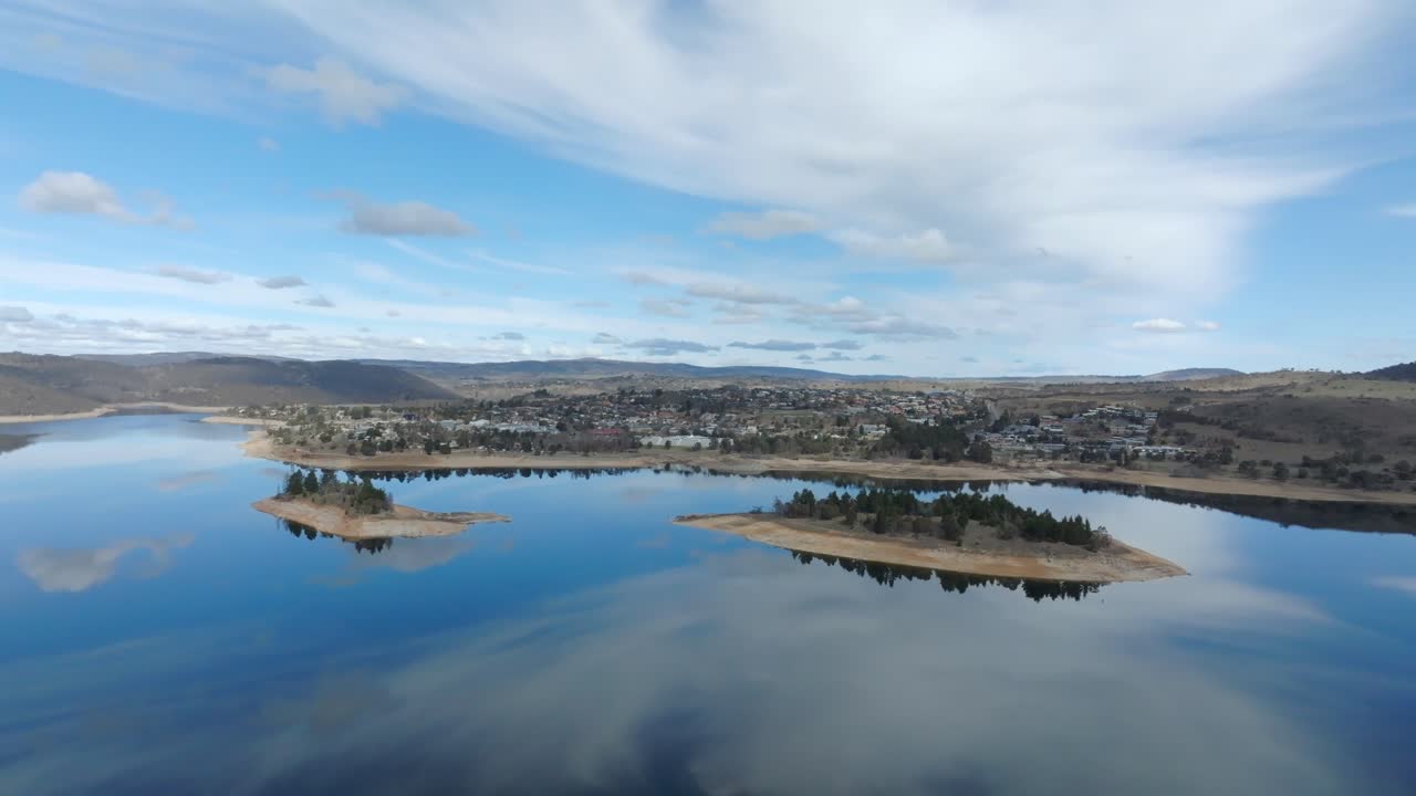 Drone wide shot of Jindabyne town and surrounding lake in the Snowy mountains, NSW