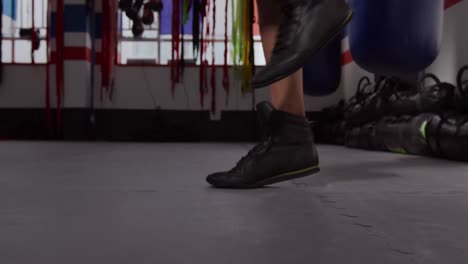 caucasian man working out in boxing gym