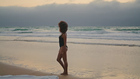sad woman overcast beach letting go white shawl. girl feeling lonely cloudy day.