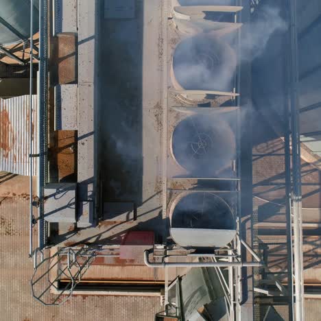 outdoor metal air dust or smoke ventilation system of a factory modern industry. pipes of grain or crop elevators. video from the top
