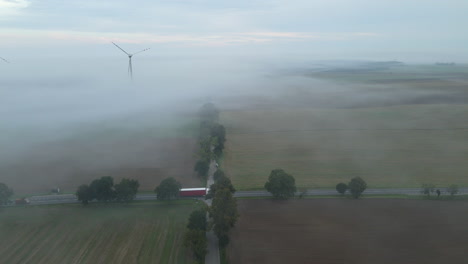 Scenic-Country-Road-Intersection-With-Cars-Drive-Through-Misty-Morning-In-Lubawa,-Poland